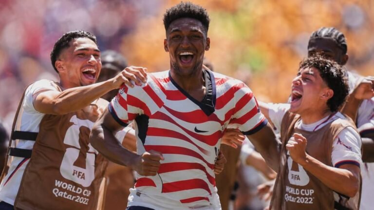 Alex Freeman celebrates with USMNT teammates after scoring a crucial header against Australia in the 2026 FIFA World Cup group stage match in Seattle.