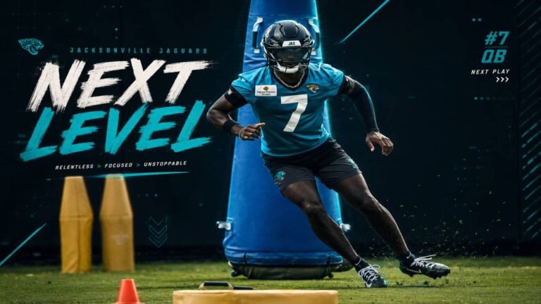 Jacksonville Jaguars wide receiver Brian Thomas Jr. leaps to secure a deep pass at 2026 mandatory minicamp, teal jersey popping against the Florida sky as fans react in the stands.
