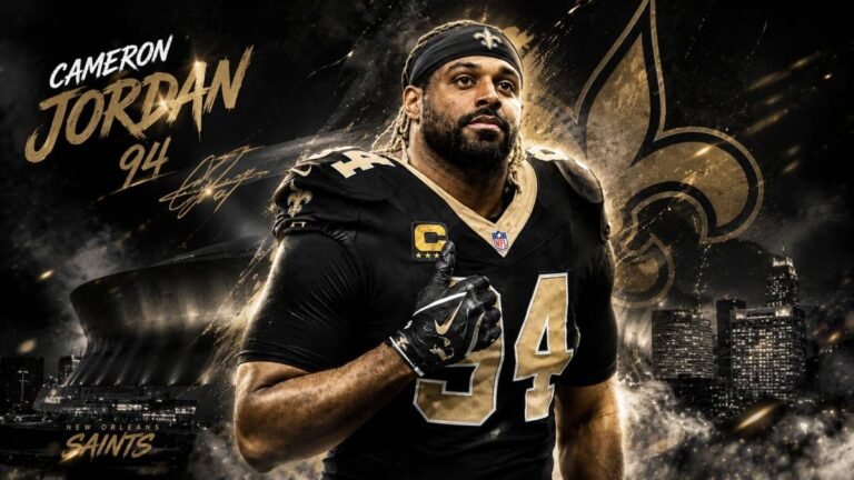 Cameron Jordan in New Orleans Saints black and gold uniform celebrating intensely on the field with fans cheering in the background during an NFL game.
