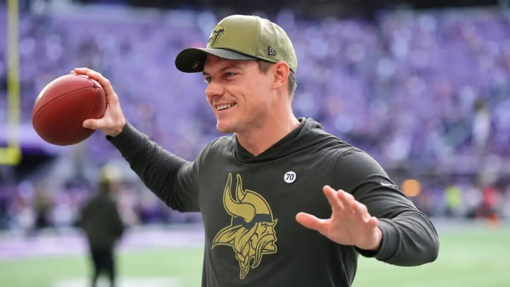 Minnesota Vikings wide receiver Luke Wysong #17 making a leaping one-handed catch during training camp in full purple and gold uniform, showcasing elite athleticism and focus.