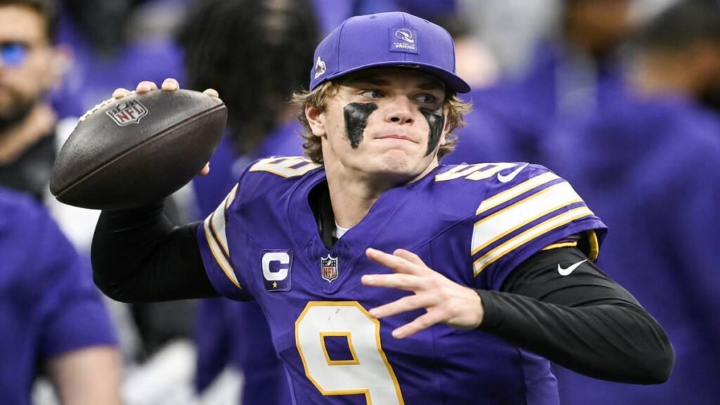 Split cinematic graphic of J.J. McCarthy in Vikings purple throwing a football on the left and Kyler Murray in intense Vikings uniform on the right, dramatic stadium lights, bold “QB BATTLE: McCarthy vs Murray for Vikings Starter” text overlay with Vikings logo.