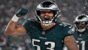 Philadelphia Eagles linebacker Zack Baun in green No. 53 jersey celebrating on the field during a game.